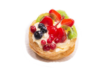 Home made cake with cream and fruits isolated.