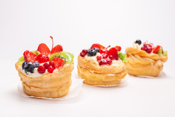 Home made cake with cream and fruits isolated.