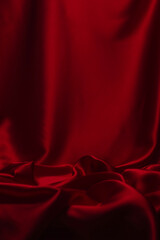 Red silk or satin luxury fabric texture can use as abstract background.