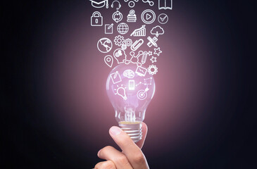 Qualification concept. Hand holds bulb, symbols knowledge, graphics and settings flow up from it