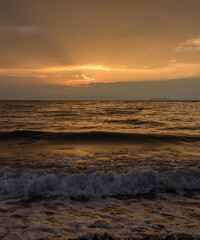 Fototapeta na wymiar Beautiful sunset with clouds and sea.