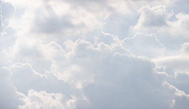 white cloud background and texture. multi cloud layers in grey sky.