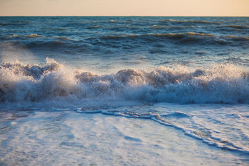 Plakat big waves in the evening at sea