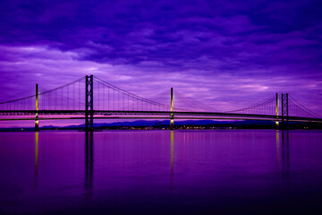 Queensferry crossing bridge over the firth of forth at blue hour from south queensferry, scotland.