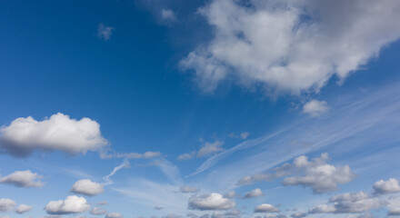 Fototapeta na wymiar Beautiful panorama of blue sky and flying white clouds, high quality, no birds, nobody..
