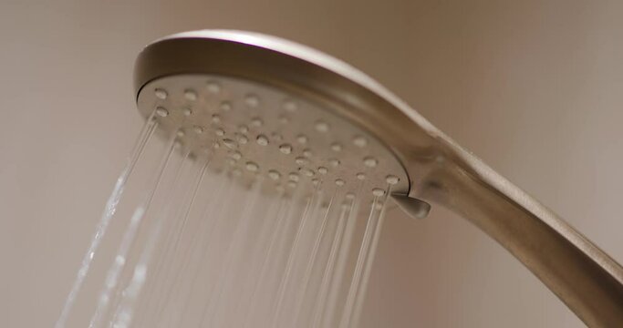 Water from shower head at bathroom