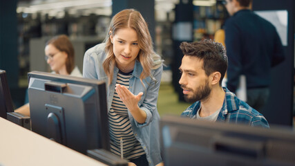 University Library: Bright Caucasian Girl and Talented Hispanic Boy Study for Exams As Team, Work...