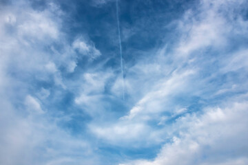Clouds on a clear Sunny spring sky as a background.