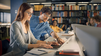 University Library: Talented Caucasian Girl uses Laptop, Smart Helpful Classmate Explains and...