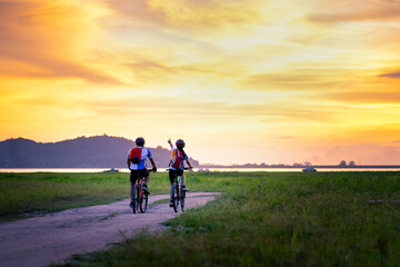 Fototapeta premium Two young bikers looking at the road in thailand.