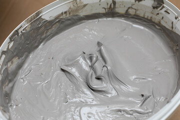 Open bucket full of moisture insulation. A container for a large amount of liquid substances.