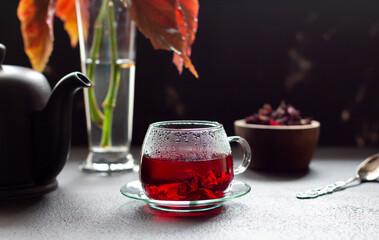 Hibiscus hot tea in glass cup, infused herbal drink to reduce blood pressure and control weight loss.