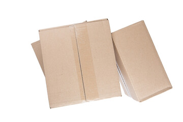 isolated close up shot of three stacked closed rectangular blank brown carton cardboard boxes on a white background
