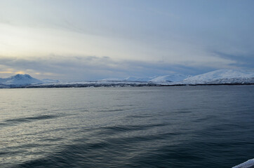 Fototapeta na wymiar blue snowy mountain and fjord landscape