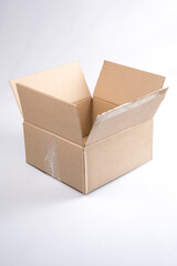 isolated close up shot of a single open blank brown empty carton cardboard box on a white background