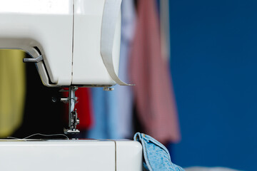 Electric sewing machine in a seamstress office