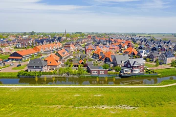 Fotobehang Aerial from the traditional village Obdam in the countryside from the Netherlands © Nataraj