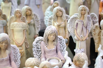 Decorative porcelain figures at Cracow Christmas market. Traditional market with handmade souvenirs, Krakow, Poland