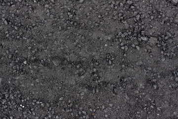 Loose asphalt. Structure for the background. Element for design of graphic works.