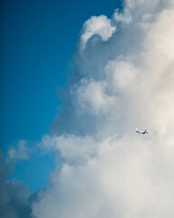 Aeroplane crossing thick clouds in Delhi sky, India