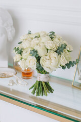 Amazing bouquet of white peonies for the bride for the wedding in the hands of a girl