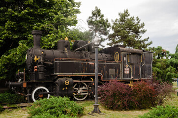 Novi Sad, Serbia - May 31. 2020: An old locomotive is on display in front of the station in the city of Novi Sad 