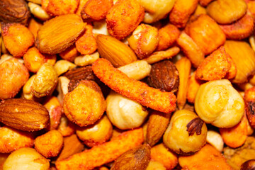A mixture of different nuts. Healthy food, fitness diet. Surface texture. Close up.