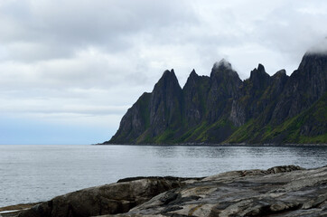 the beautiful jagged mountain of Okshornan on senja island in summer