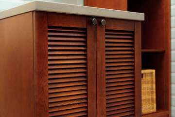 Modern bathroom interior details with wooden furniture and mint tile walls