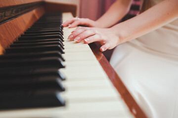 Fototapeta premium Playing Piano (shallow DOF; color toned image)