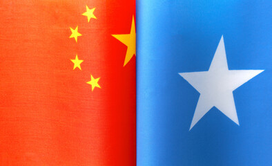 fragments of the national flags of China and Somalia close up