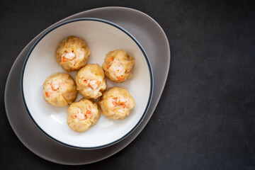 Homemade Chinese steamed shrimp dumpling or Shumai in bowl