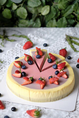 Low Fat Mousse Yogurt Strawberry and Raspberry Cheesecake set on cafe table.  Gluten Free Low-Carb Healthy Dessert.