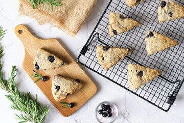 Triangle blueberry scones. a Traditional British baked good. set on cafe table.