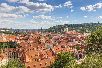 Fototapeta na wymiar Amazing European cityscape.Aerial view of old town with hictorical buildings,red roofs,churches,skyscrapers in Prague,Czechia.Prague panorama.Beautiful sunny landscape of the capital of Czechia.