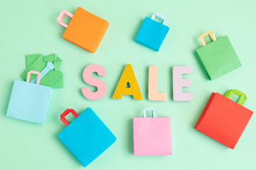Word Sale and shopping paper bags. Sesonal sale, online deals, discounts, promotion, shopping addiction idea