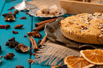 Turkish halva national dessert on blue wooden table