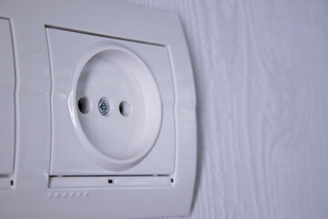 Sockets for electrical appliances on a light gray wall. a multifunction outlet. High quality photo