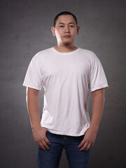 T-shirt mock up, front view. Male model wear plain white tshirt mockup. Shirt design template