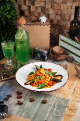 Gourmet seafood spaghetti pasta on wooden table