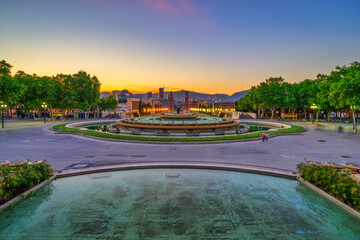 Fototapeta na wymiar Magic fountain at sunset near Spanish square in Barcelona, Spain