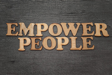 Empower People, word text typography written with vintage wooden alphabet letterpress