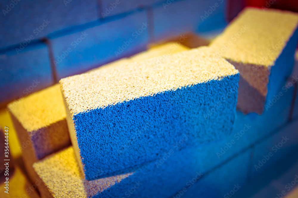 Poster foam block. construction bricks close up. concept - foam block of construction. foam concrete bricks