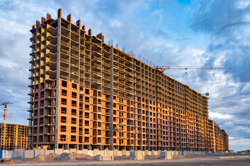 Multi-storey residential development. Construction of multi-storey building. Unfinished house on...