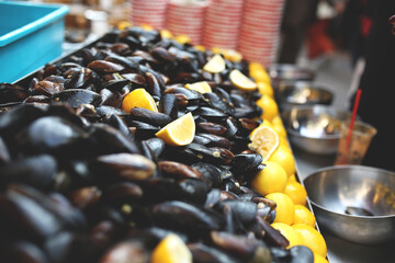 A display of fresh mussels for sale at a fish market