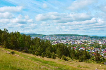 Fototapeta premium View of the old part of the city of Miassa. It is located in the southern part of the city. In the background you can see the mountain ranges of the southern Urals