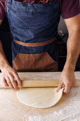 making dough man hand flour