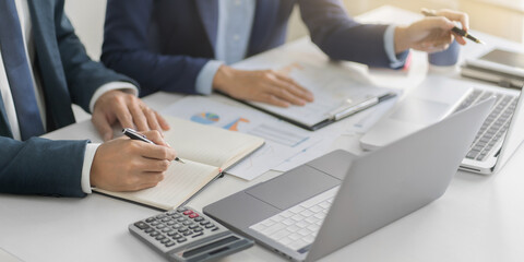 Financial inspector calculating a numbers in office room.