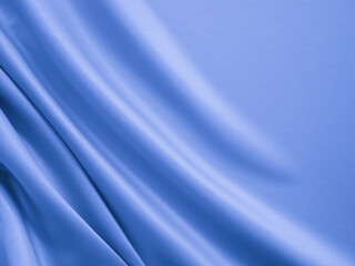 Smooth elegant wavy blue satin silk luxury cloth fabric texture, abstract background design.
