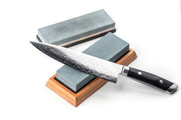 Japanese chef's knife and whetstones isolated on white background